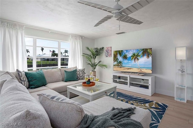1432 Wellington Ct, Cape Coral, FL 33904 - living room with wood finished floors, a ceiling fan, and baseboards