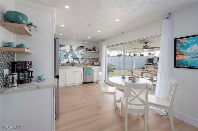 1432 Wellington Ct, Cape Coral, FL 33904 - dining space featuring bar area, light wood finished floors, recessed lighting, and ceiling fan