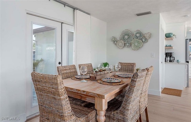 1432 Wellington Ct, Cape Coral, FL 33904 - dining space with light wood-type flooring