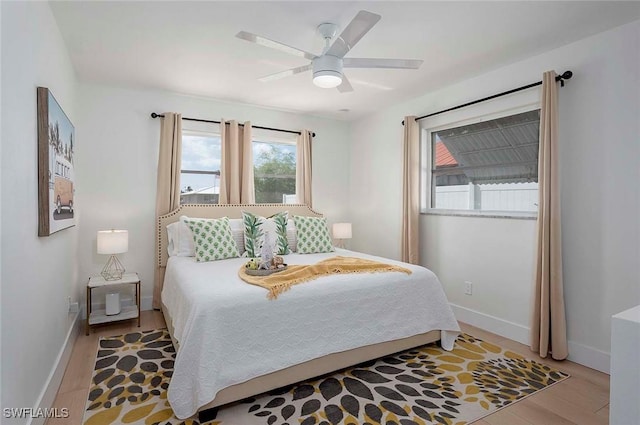 1432 Wellington Ct, Cape Coral, FL 33904 - bedroom with wood finished floors, baseboards, and ceiling fan