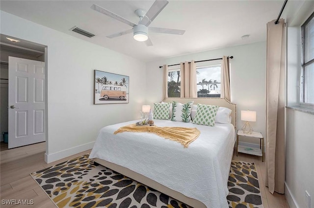 1432 Wellington Ct, Cape Coral, FL 33904 - bedroom with baseboards, light wood-style flooring, and ceiling fan