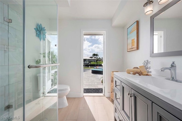1432 Wellington Ct, Cape Coral, FL 33904 - bathroom featuring toilet, vanity, and a shower stall
