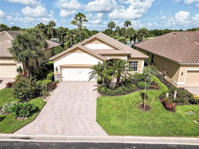 3181 Bramble Cove Ct, Fort Myers, FL 33905 - ranch-style house featuring stucco siding, decorative driveway, a front yard, and an attached garage