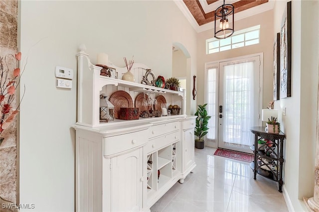 3181 Bramble Cove Ct, Fort Myers, FL 33905 - entrance foyer featuring ornamental molding, a towering ceiling, and arched walkways