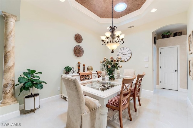 3181 Bramble Cove Ct, Fort Myers, FL 33905 - dining space with a tray ceiling, ornamental molding, arched walkways, a chandelier, and decorative columns