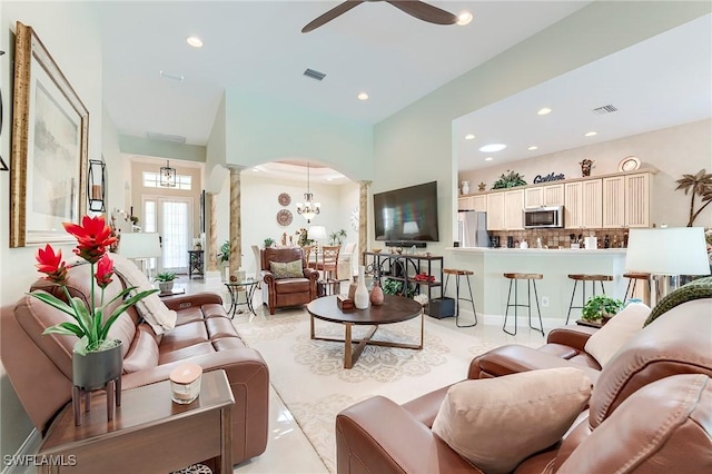 3181 Bramble Cove Ct, Fort Myers, FL 33905 - living room featuring ornate columns, a ceiling fan, recessed lighting, arched walkways, and a chandelier