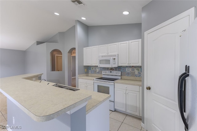 460 Petite Ave, Lehigh Acres, FL 33974 - kitchen with white appliances, decorative backsplash, light countertops, light tile patterned flooring, and white cabinets