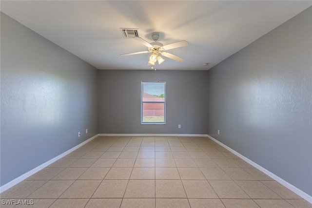 460 Petite Ave, Lehigh Acres, FL 33974 - empty room featuring ceiling fan, baseboards, and light tile patterned floors