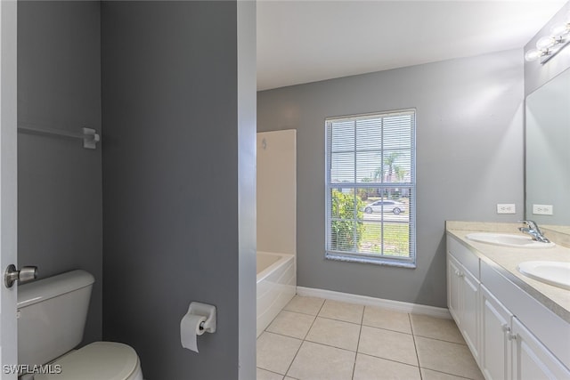 460 Petite Ave, Lehigh Acres, FL 33974 - full bathroom featuring double vanity, tile patterned flooring, toilet, baseboards, and tub / shower combination