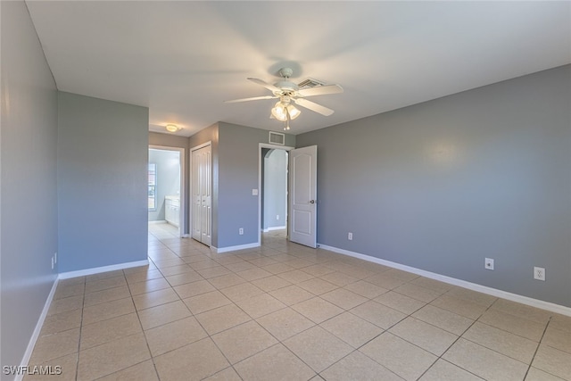 460 Petite Ave, Lehigh Acres, FL 33974 - empty room with a ceiling fan, baseboards, and light tile patterned flooring