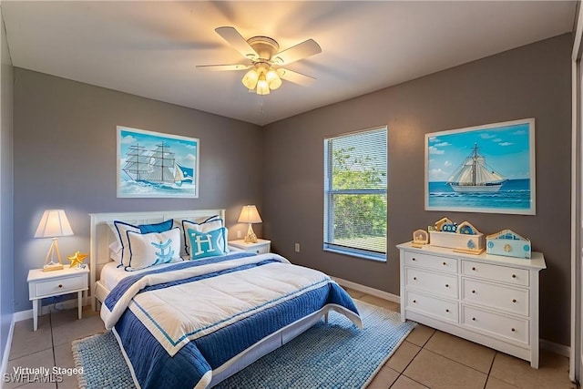 460 Petite Ave, Lehigh Acres, FL 33974 - bedroom featuring light tile patterned floors, baseboards, and a ceiling fan