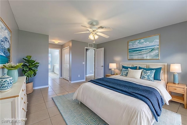 460 Petite Ave, Lehigh Acres, FL 33974 - bedroom with light tile patterned floors, baseboards, a closet, ensuite bath, and ceiling fan