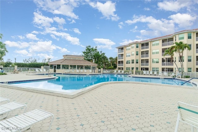 4005 Palm Tree Blvd Unit 103, Cape Coral, FL 33904 - community pool featuring a patio area