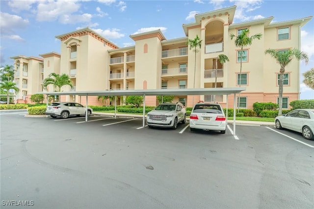 4005 Palm Tree Blvd Unit 103, Cape Coral, FL 33904 - view of apartment building / complex with covered parking