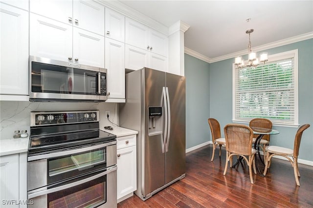 4005 Palm Tree Blvd Unit 103, Cape Coral, FL 33904 - kitchen with stainless steel appliances, baseboards, a chandelier, light countertops, and ornamental molding