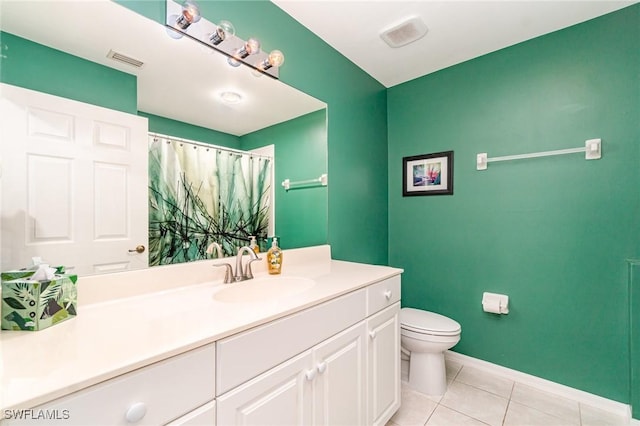 4005 Palm Tree Blvd Unit 103, Cape Coral, FL 33904 - full bathroom featuring toilet, vanity, tile patterned flooring, and baseboards