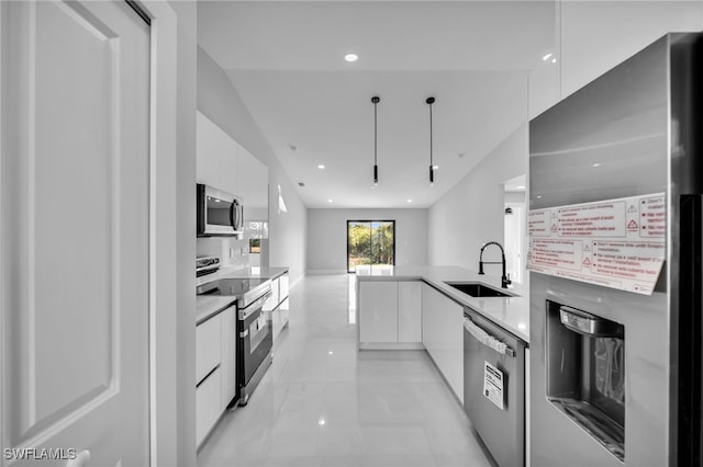 814 Edward Ave, Lehigh Acres, FL 33936 - kitchen featuring stainless steel appliances, modern cabinets, white cabinets, a sink, and recessed lighting