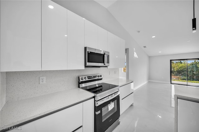 814 Edward Ave, Lehigh Acres, FL 33936 - kitchen with appliances with stainless steel finishes, modern cabinets, white cabinetry, backsplash, and recessed lighting