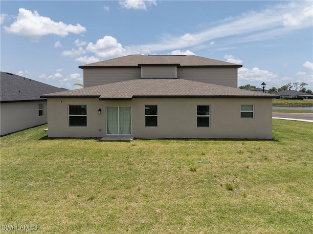 4005 Cavassa Ct, North Fort Myers, FL 33917 - rear view of house with a yard, a shingled roof, and stucco siding
