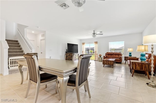 4005 Cavassa Ct, North Fort Myers, FL 33917 - dining area featuring ceiling fan, stairs, and light tile patterned floors