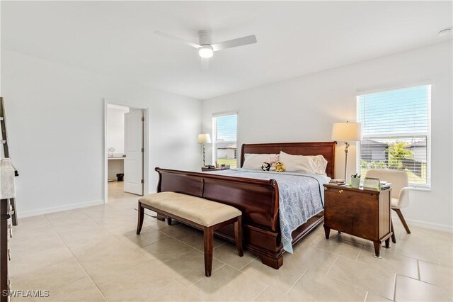 4005 Cavassa Ct, North Fort Myers, FL 33917 - bedroom featuring baseboards, light tile patterned floors, and a ceiling fan