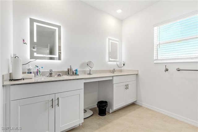 4005 Cavassa Ct, North Fort Myers, FL 33917 - bathroom with double vanity, baseboards, and tile patterned floors