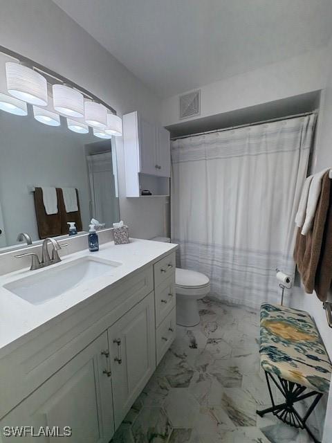 3358 N Key Dr Unit 2, North Fort Myers, FL 33903 - full bathroom with vanity, marble look tiles, toilet, and curtained shower