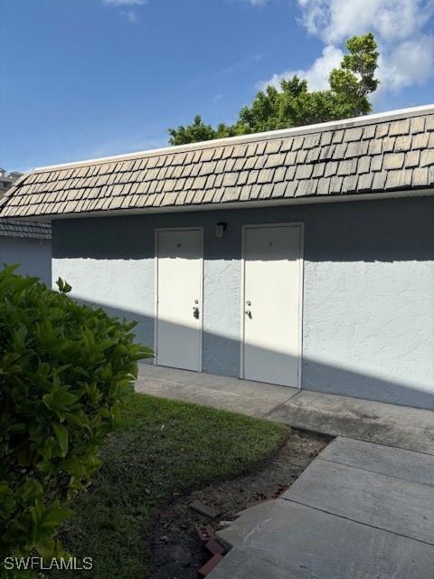 3358 N Key Dr Unit 2, North Fort Myers, FL 33903 - property entrance featuring stucco siding