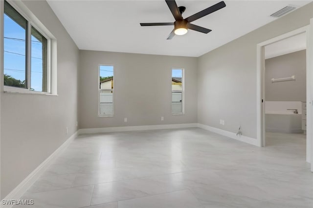 1118 SW 41st Ter, Cape Coral, FL 33914 - spare room with ceiling fan and baseboards