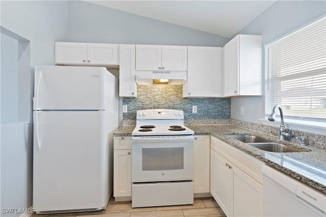 2208/2210 Haviland Ave S, Lehigh Acres, FL 33973 - kitchen with white appliances, under cabinet range hood, a sink, white cabinets, and lofted ceiling
