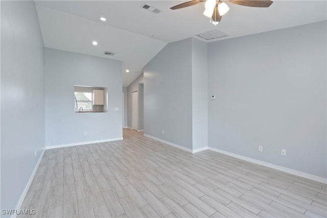 2208/2210 Haviland Ave S, Lehigh Acres, FL 33973 - unfurnished room featuring ceiling fan, baseboards, light wood-style floors, recessed lighting, and vaulted ceiling