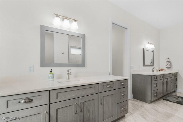 2228 SW 15th Ave, Cape Coral, FL 33991 - bathroom with two vanities and marble look tiles