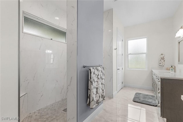 2228 SW 15th Ave, Cape Coral, FL 33991 - bathroom with a marble finish shower, vanity, baseboards, and marble finish floors