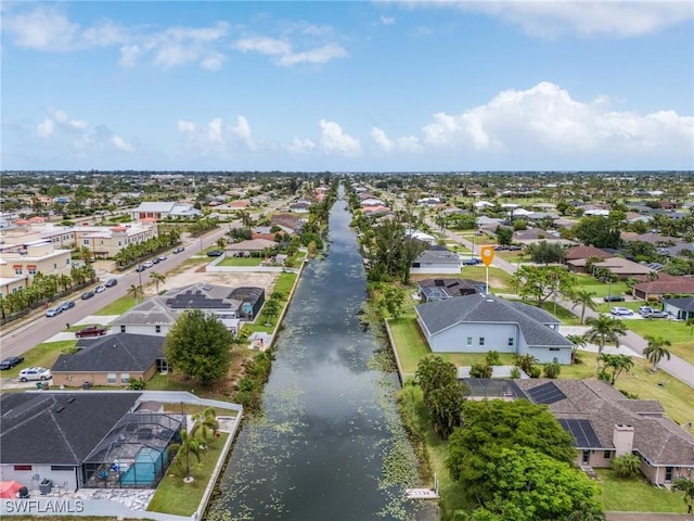 2228 SW 15th Ave, Cape Coral, FL 33991 - aerial perspective of suburban area with a large body of water