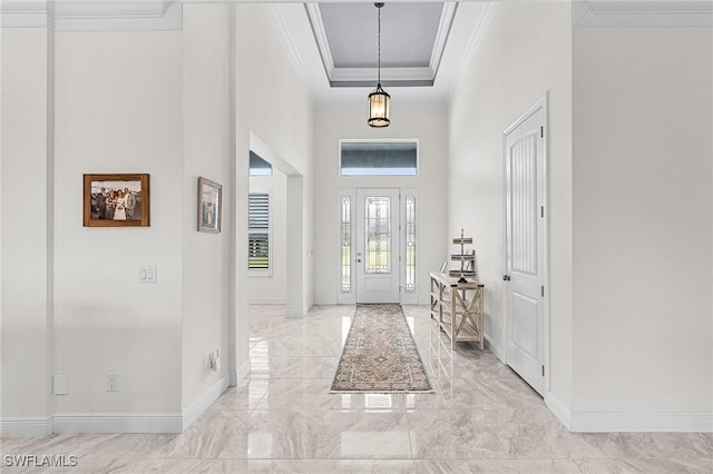 2228 SW 15th Ave, Cape Coral, FL 33991 - entrance foyer with light marble finish flooring, crown molding, baseboards, a raised ceiling, and a high ceiling