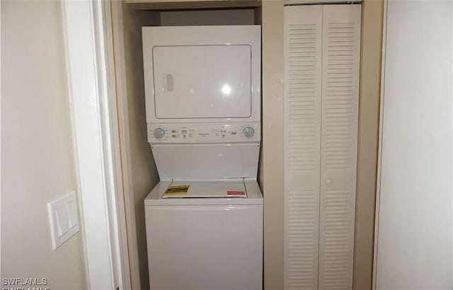 3303 Royal Canadian Trce Unit 4, Fort Myers, FL 33907 - laundry room featuring stacked washer / drying machine