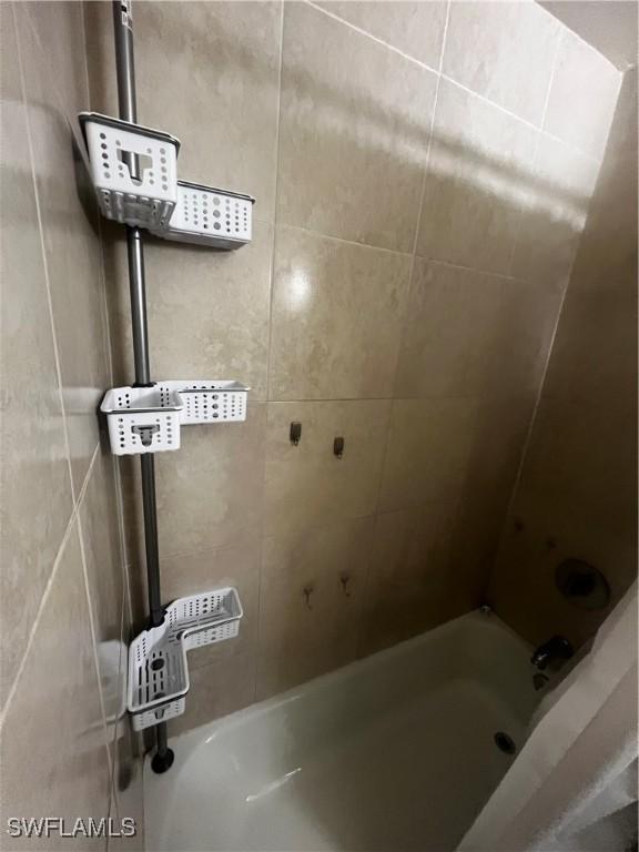 3303 Royal Canadian Trce Unit 4, Fort Myers, FL 33907 - bathroom with bathtub / shower combination