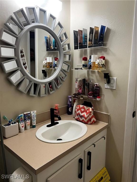 3303 Royal Canadian Trce Unit 4, Fort Myers, FL 33907 - bathroom featuring vanity