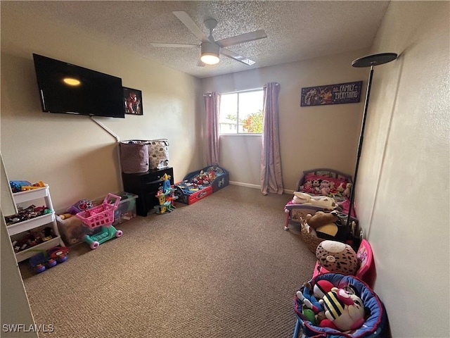 3303 Royal Canadian Trce Unit 4, Fort Myers, FL 33907 - rec room with a textured ceiling, ceiling fan, and baseboards