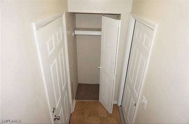 3303 Royal Canadian Trce Unit 4, Fort Myers, FL 33907 - hallway featuring light tile patterned floors
