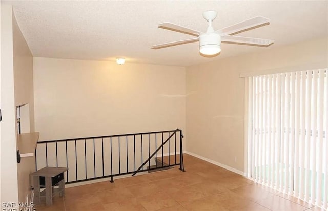3303 Royal Canadian Trce Unit 4, Fort Myers, FL 33907 - empty room with ceiling fan, tile patterned flooring, and baseboards