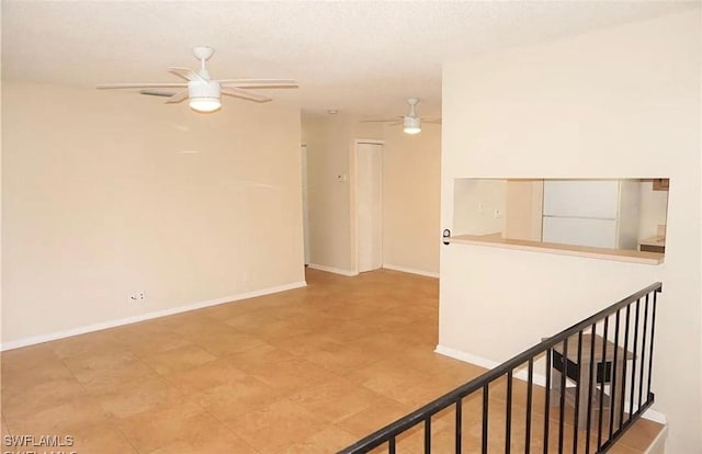 3303 Royal Canadian Trce Unit 4, Fort Myers, FL 33907 - unfurnished room featuring a ceiling fan and baseboards
