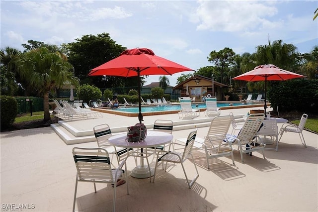 3303 Royal Canadian Trce Unit 4, Fort Myers, FL 33907 - view of patio featuring a community pool