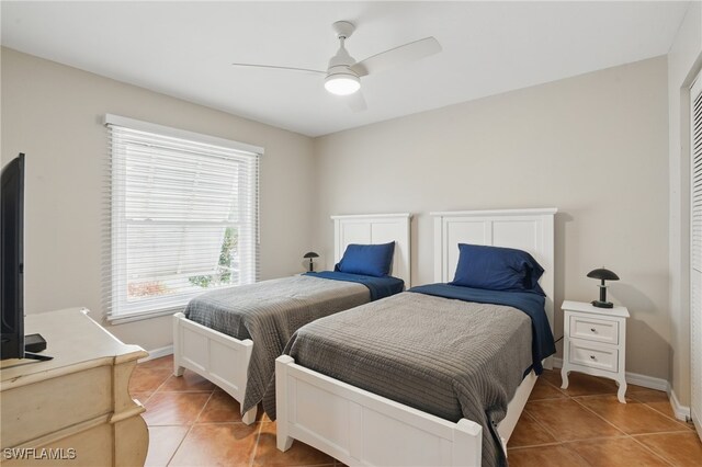 3604 Sudbury Ln, Bonita Springs, FL 34134 - bedroom with light tile patterned flooring, baseboards, and ceiling fan