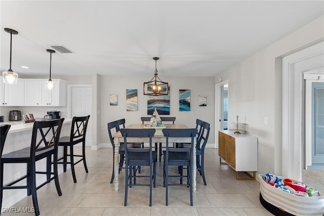 3117 SE 18th Ave, Cape Coral, FL 33904 - dining area featuring light tile patterned floors and baseboards