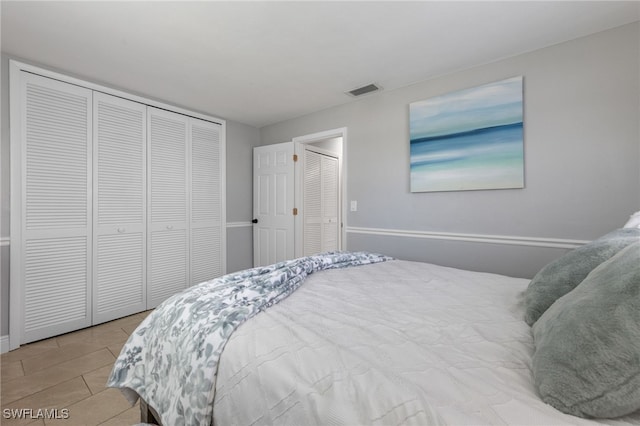 3117 SE 18th Ave, Cape Coral, FL 33904 - tiled bedroom featuring a closet and baseboards