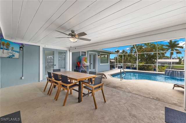 3117 SE 18th Ave, Cape Coral, FL 33904 - outdoor pool featuring a patio, ceiling fan, outdoor dining space, and glass enclosure
