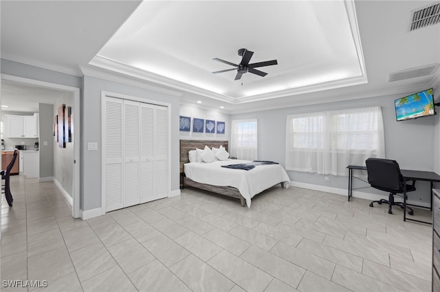 3117 SE 18th Ave, Cape Coral, FL 33904 - bedroom featuring a tray ceiling, crown molding, light tile patterned floors, baseboards, and a ceiling fan