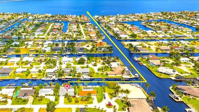 3117 SE 18th Ave, Cape Coral, FL 33904 - aerial perspective of suburban area with a nearby body of water