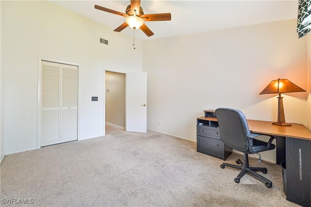 17458 Blueberry Hill Dr Unit F, Fort Myers, FL 33908 - office space featuring carpet floors, a ceiling fan, and a towering ceiling